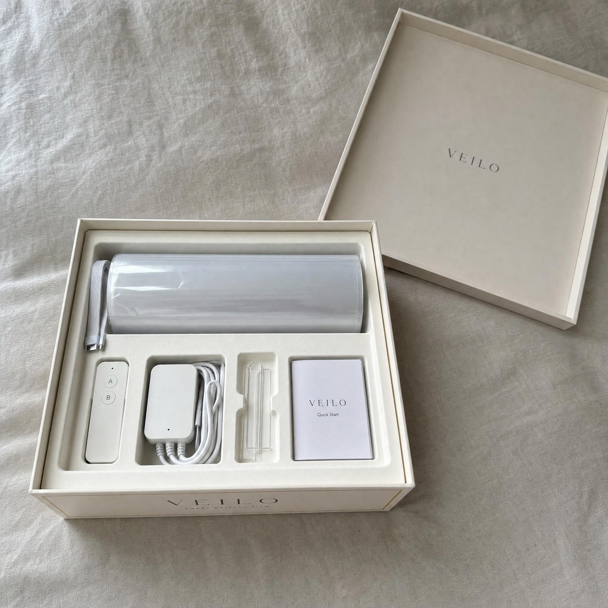 What's in the Veilo box: film, remote, power adapter, install kit