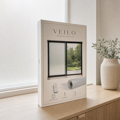 Veilo smart privacy film box in front of a frosted window